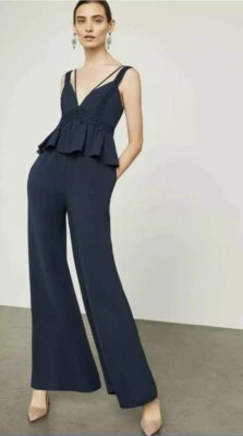 Mono BCBGMAXAZRIA NUEVO CON ETIQUETAS PRECIO DE VENTA SUGERIDO POR EL FABRICANTE $368 Peplum pierna ancha azul marino talla XXS Foto 1 de 4