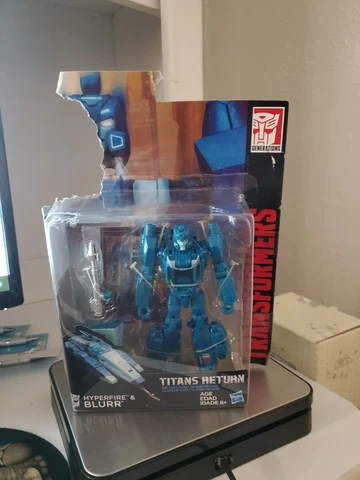 Deluxe Blurr and Hyperfire | Transformers Generations Titans Return Hasbro Cover