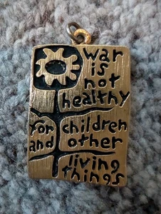 VINTAGE 1968 WAR iS NOT HEALTHY HIPPIE STYLE WAR PROTEST PENDANT - Picture 1 of 4