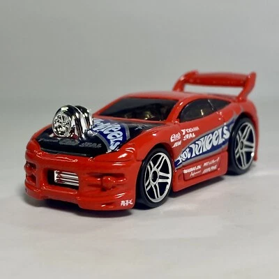 Коллекционный литой автомобиль Mitsubishi Eclipse (Tooned) первое издание 1:64 No054 красный - Изображение 1 из 4