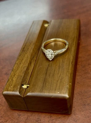 Zales 3/8 CT. T.W. Pear-Shaped Diamond Frame Twist Engagement in 10K Gold.Size 8 - Image 1 of 4