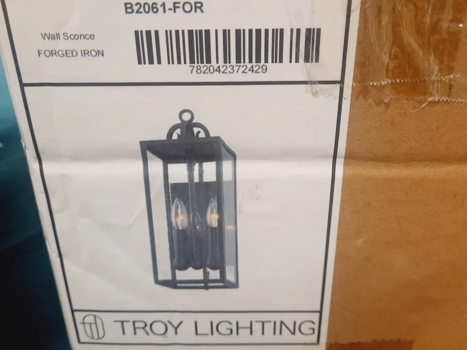 Aplique de pared exterior Troy Lighting B2061-FOR Caiden *SIN VIDRIO* Foto 1 de 4