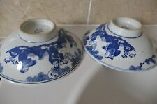 2 CHINESE PORCELAIN 20CM BOWLS WITH BLUE /WHITE FLOWERS BORDER + FIGURES ON BASE
