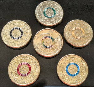2 dollar coins with coloured rings