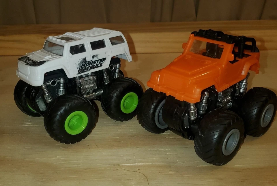 2 juguetes Monster Truck tapas intercambiables acción de empuje rodante 4,5" x 4,5" Foto 1 de 4