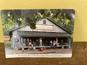 Cartolina vintage inutilizzata Country Store Skylake Sautée-Nacoochee Georgia Coca Cola - Foto 1 di 3