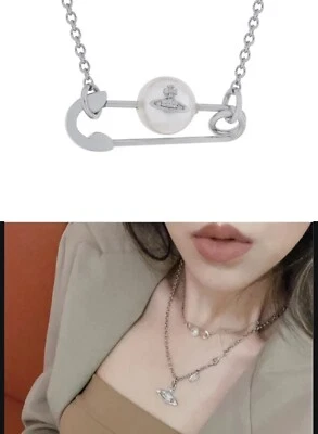 Pin de seguridad Jordon tono plata con collar colgante orbe de perlas. Foto 1 de 4