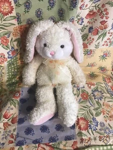 Aurora Sparkly Yellow Rabbit Plushie With A Red And Yellow-flowered Ribbon. - Picture 1 of 6