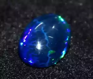 Opale etiope nero naturale 7,75 ct 100% ovale Welo fuoco cabochon pietra preziosa sciolta - Foto 1 di 3