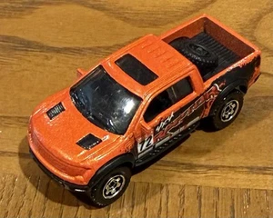 2009 MATCHBOX 2010 FORD F-150 SVT RAPTOR #72 ORANGE DIECAST ~2.5" PICKUP TRUCK - Picture 1 of 6