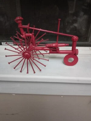 Vintage-Collectable Handmade Tractor-red metal-from nuts-bolts-spark plug-nails - Image 1 of 2