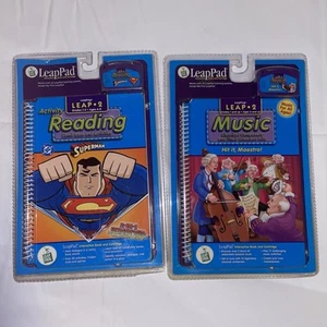 Two LeapPads  2. Books Superman & Cartridges. Reading And Music. New. - Picture 1 of 4
