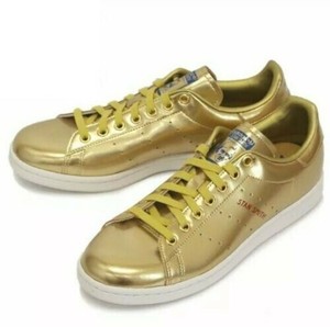 tenis adidas dourado masculino