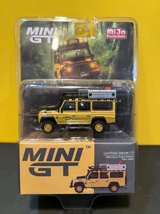 1/64 MINI GT MIJO EXCLUSIVES LAND ROVER DEFENDER 110 1989 CAMEL TROPHY AMAZON - Picture 1 of 2