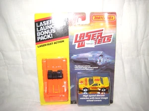 Lotto bonus ruote laser Matchbox MIP con Pontiac Fiero 1985 e lanciatore arancione - Foto 1 di 6