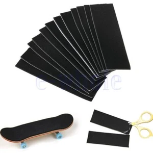 12 Fingerboard Fingerskateboard Deck Skateboard Grip Tape Aufkleber Spielzeug AE - Bild 1 von 6