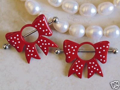 Escudo/anillo pezón lazo lunares rojo. Foto 1 de 4