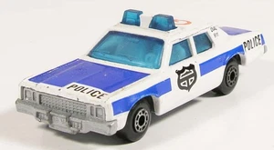 MATCHBOX 10 PLYMOUTH GRAN FURY POLICE CAR BLACK SHIELD NO DOOR SHUTS MACAU - Picture 1 of 5