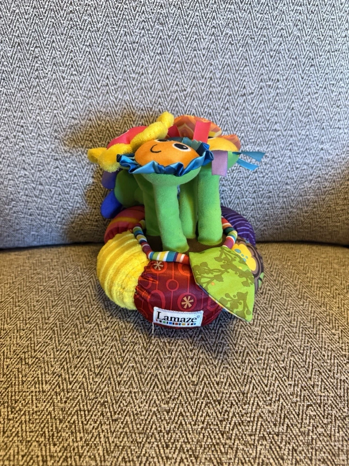 Juguete suave de terapia de desarrollo sensorial musical iluminado para bebé con flores lamaze Foto 1 de 4