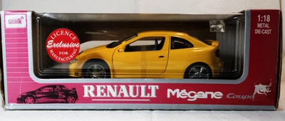 Modelli smo Renault Megane 1/18 gialla (scatola usurata ,rim. di magazzino) - Immagine 1 di 4