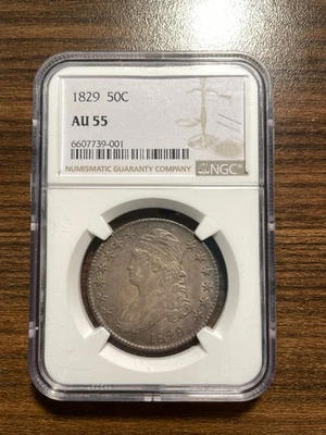 Medio dólar de plata busto tapado 1829-P 50C NGC AU 55 tipo 1, borde con letras O-108A Foto 1 de 4