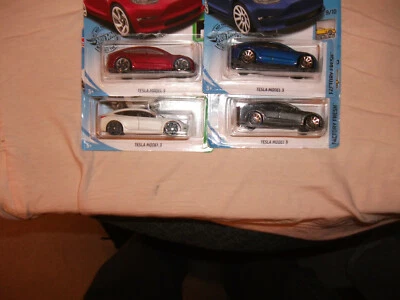 Hot Wheels Tesla Model 3's:1 Red, 1 White, 1 Blue,& 1 Grey, Lot Of 4 NIP VHTF - Image 1 of 4