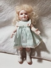 Small ANTIQUE DOLL with simple dress