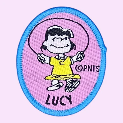 LUCY PLAYING JUMPROPE PEANUTS CARTOON CUTE FUNNY WOVEN SEW ON PATCH 2.25 X 1.9" - Image 1 of 4