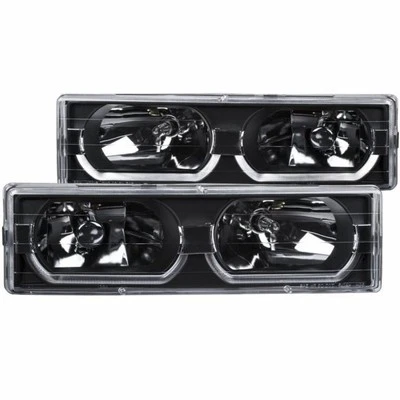 Faros de cristal negros ANZO para GMC K1500/K2500 Suburban 1992-1999 con ceja baja Foto 1 de 4