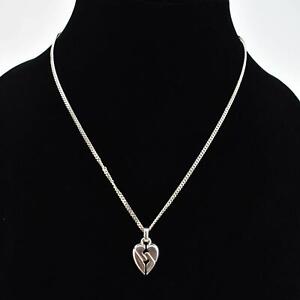 GUCCI: Sterling Silver, "Broken Heart" Logo Necklace (on)