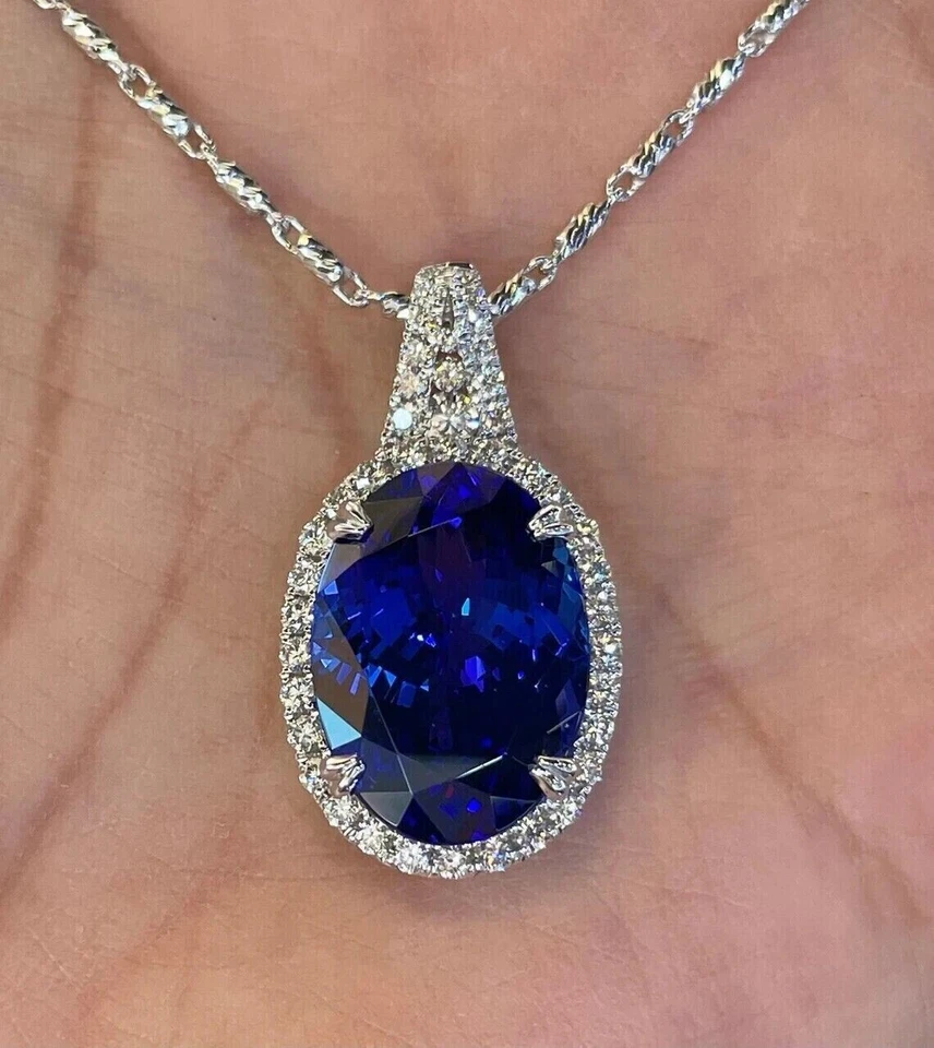 Colgante con halo de zafiro azul natural corte ovalado de 2,0 quilates chapado en oro blanco de 14 quilates cadena de 18" Foto 1 de 4