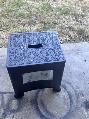 Black Plastic Step Stool with Textured Surface and Handle - Image 1 of 4