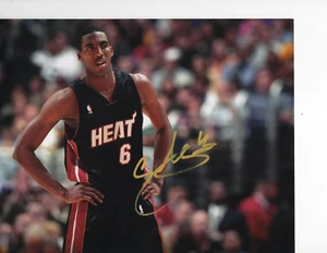 MIAMI HEAT EDDIE JONES SIGNED BLACK JERSEY 8X10 - Picture 1 of 1