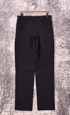 Pantalones ALO 31 para hombre día y noche calce ajustado gris oscuro tela de rendimiento Foto 1 de 4