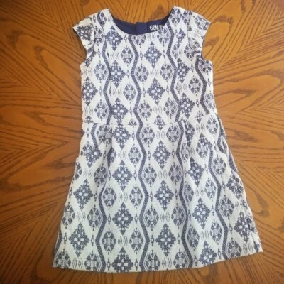 Vestido Genuino Niños Oshkosh Niñas Azul Oscuro y Blanco Bonito Patrón Geométrico Foto 1 de 4
