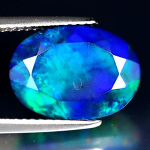 3.72 ct Fair Oval (14 x 10 mm) Flashing 360 Degree Multicolor Black Opal - Picture 1 of 2