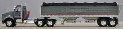 DCP/PRIMERA MARCHA ESCALA 1/64 T-800 KENWORTH CABINA CORTA CON REMOLQUE WILSON 34' GRANO Foto 1 de 4