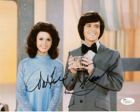 DONNY+MARIE OSMOND HAND SIGNED 8x10 COLOR PHOTO      SIGNED BY BOTH         JSA Cover