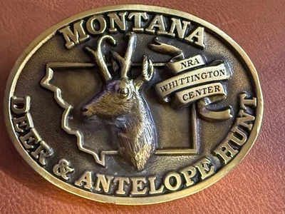 Hebilla de cinturón de latón Montana Deer & Antelope Hunt NRA Whittington Center  Foto 1 de 2