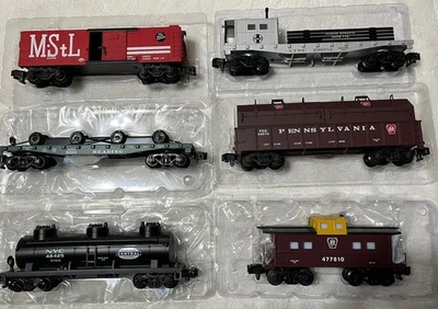 6 Cars @ 1/2 off.  Boxcar, Flatcar, Gondola, Tank, Boom Car & Caboose. All NIB - Image 1 of 4