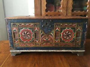Antique chest carved and painted in the 18th century