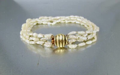 Brazalete con cuentas de perlas de arroz de agua dulce de oro amarillo de 14K con múltiples hilos Foto 1 de 4