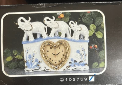 VINTAGE ELEPHANT PORCELAIN QUARTZ TABLE CLOCK - Image 1 of 4