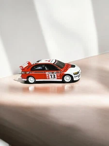 2004 MITSUBISHI LANCER EVO RALLY RACER LIMITED EDITION COLLECTIBLE 1/64 SCALE - Picture 1 of 4