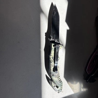 Cuchillo táctico ojo de serpiente 3cr13 hoja de acero 3 3/8” B-131x47x21mm verde camuflaje Foto 1 de 4