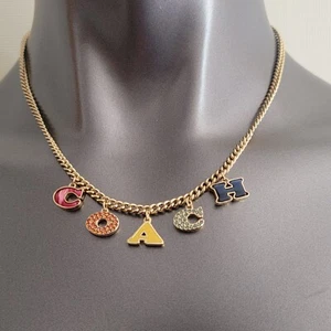 COACH Pavé Charm Rainbow Station Logo Necklace Gold Tone Adjustable - Picture 1 of 6