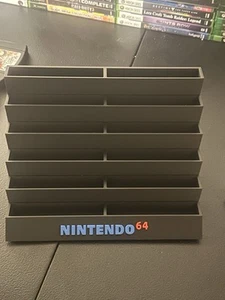 N64 NINTENDO 12 SLOT SUPPORTO GIOCHI CUSTODIA CARTUCCIA - Foto 1 di 2