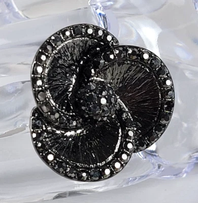 Anillo elástico flor cóctel talla 8-13 expandible tono bronce marcasita pavé Foto 1 de 4