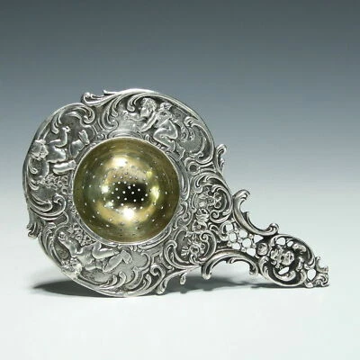 Colador de té alemán Hanau plata .800 oro overcup querubines florales 19 C en muy buena condición Foto 1 de 4