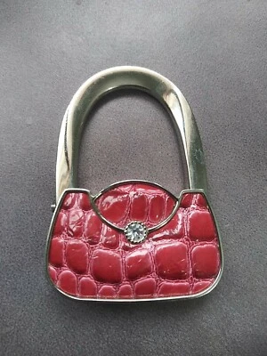 Cartera rosa con estrás buscador de ganchos Foto 1 de 3